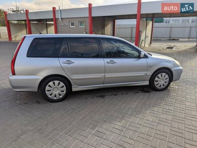 Сірий Міцубісі Lancer, об'ємом двигуна 1.58 л та пробігом 220 тис. км за 4499 $, фото 13 на Automoto.ua