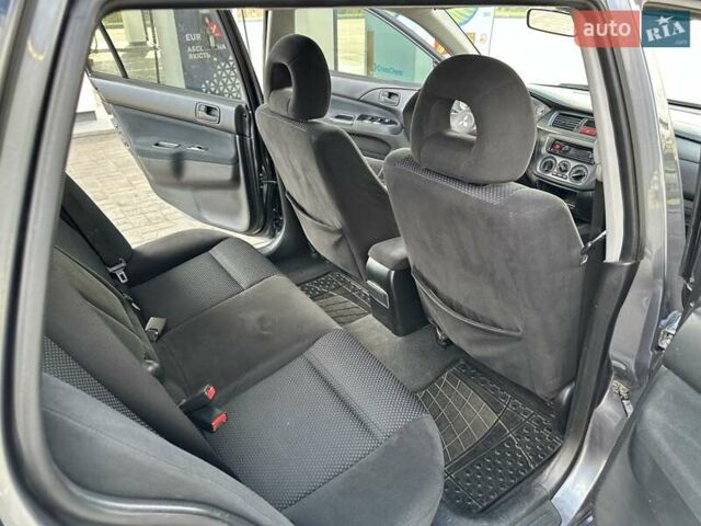 Сірий Міцубісі Lancer, об'ємом двигуна 1.59 л та пробігом 279 тис. км за 4999 $, фото 31 на Automoto.ua