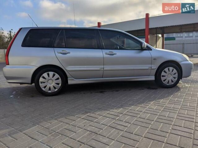 Сірий Міцубісі Lancer, об'ємом двигуна 1.58 л та пробігом 220 тис. км за 4499 $, фото 12 на Automoto.ua