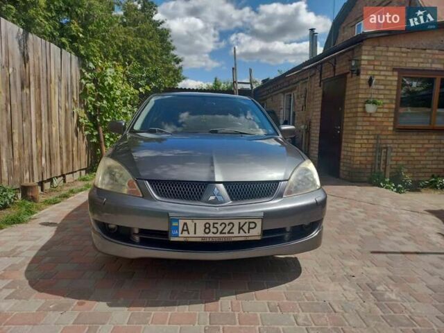 Сірий Міцубісі Lancer, об'ємом двигуна 1.6 л та пробігом 279 тис. км за 5800 $, фото 31 на Automoto.ua