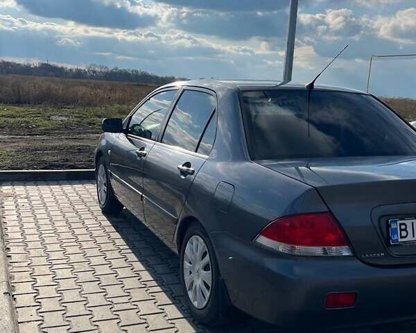 Серый Мицубиси Лансер, объемом двигателя 1.6 л и пробегом 255 тыс. км за 4500 $, фото 1 на Automoto.ua