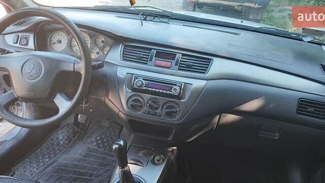 Сірий Міцубісі Lancer, об'ємом двигуна 1.6 л та пробігом 186 тис. км за 4200 $, фото 6 на Automoto.ua