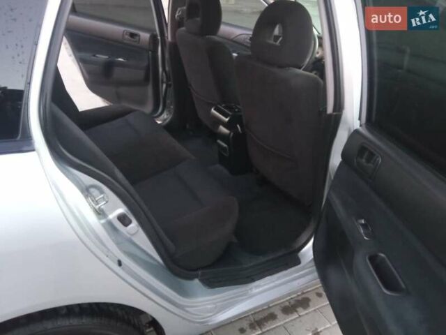 Сірий Міцубісі Lancer, об'ємом двигуна 1.58 л та пробігом 258 тис. км за 2999 $, фото 14 на Automoto.ua