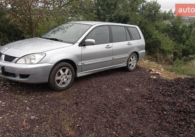 Серый Мицубиси Лансер, объемом двигателя 1.58 л и пробегом 296 тыс. км за 3850 $, фото 1 на Automoto.ua