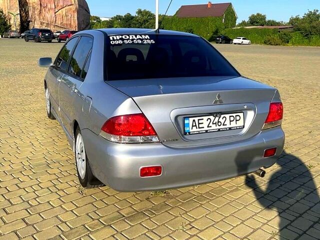 Сірий Міцубісі Lancer, об'ємом двигуна 1.6 л та пробігом 241 тис. км за 4950 $, фото 6 на Automoto.ua