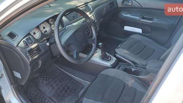 Сірий Міцубісі Lancer, об'ємом двигуна 1.6 л та пробігом 186 тис. км за 4200 $, фото 8 на Automoto.ua