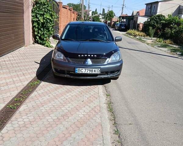 Серый Мицубиси Лансер, объемом двигателя 2 л и пробегом 267 тыс. км за 4350 $, фото 5 на Automoto.ua