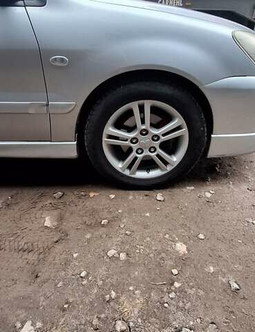 Серый Мицубиси Лансер, объемом двигателя 1.58 л и пробегом 223 тыс. км за 3200 $, фото 9 на Automoto.ua