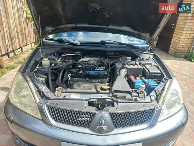 Сірий Міцубісі Lancer, об'ємом двигуна 1.6 л та пробігом 279 тис. км за 5800 $, фото 28 на Automoto.ua