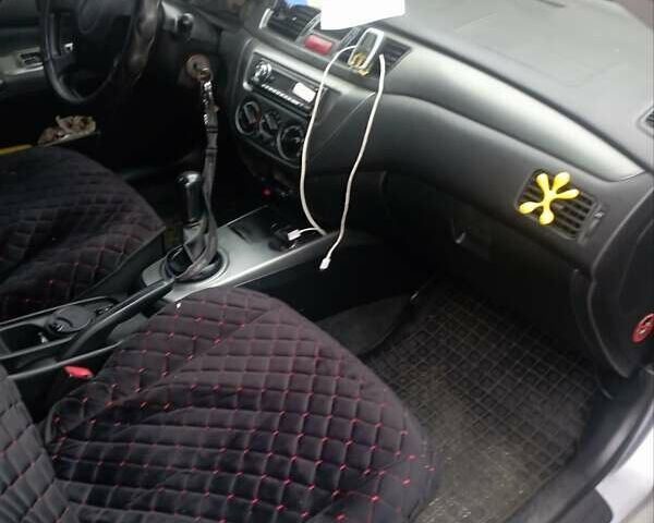 Серый Мицубиси Лансер, объемом двигателя 1.6 л и пробегом 350 тыс. км за 3000 $, фото 2 на Automoto.ua