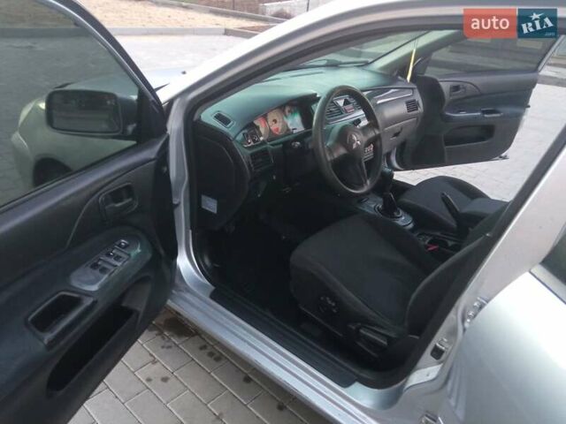 Сірий Міцубісі Lancer, об'ємом двигуна 1.58 л та пробігом 258 тис. км за 2999 $, фото 10 на Automoto.ua