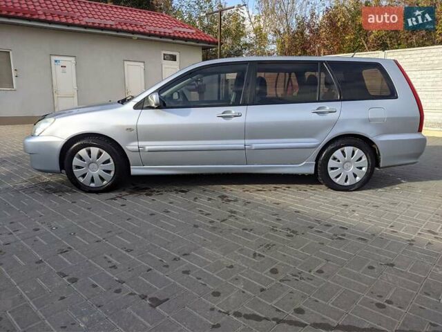 Сірий Міцубісі Lancer, об'ємом двигуна 1.58 л та пробігом 220 тис. км за 4499 $, фото 7 на Automoto.ua