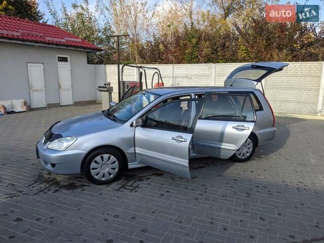 Сірий Міцубісі Lancer, об'ємом двигуна 1.58 л та пробігом 220 тис. км за 4499 $, фото 25 на Automoto.ua