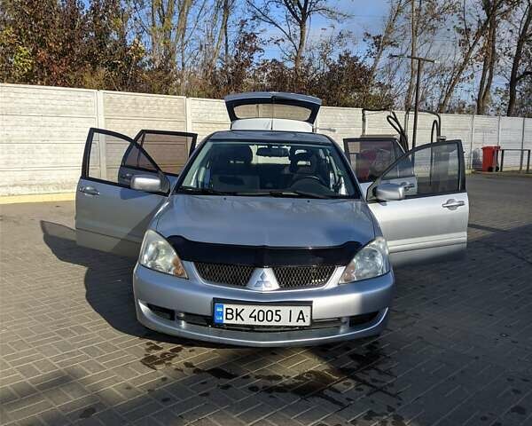 Сірий Міцубісі Lancer, об'ємом двигуна 1.58 л та пробігом 220 тис. км за 4499 $, фото 24 на Automoto.ua