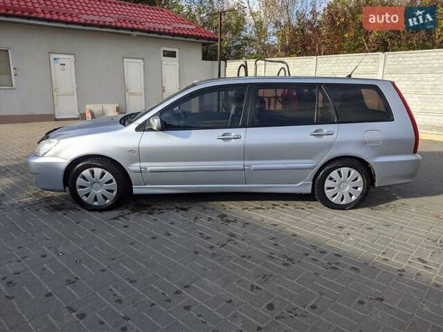 Сірий Міцубісі Lancer, об'ємом двигуна 1.58 л та пробігом 220 тис. км за 4499 $, фото 6 на Automoto.ua