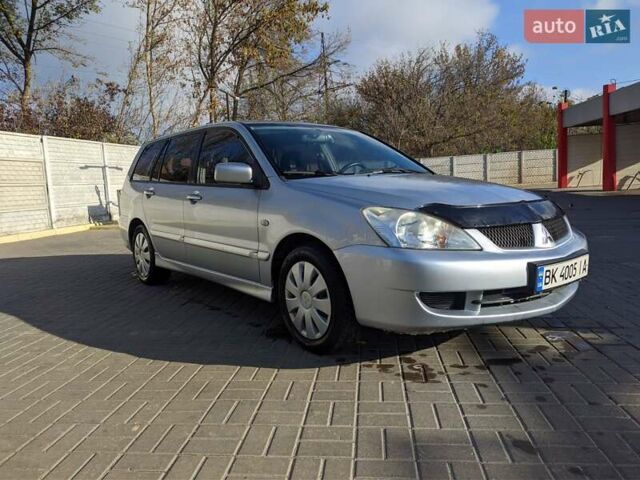 Сірий Міцубісі Lancer, об'ємом двигуна 1.58 л та пробігом 220 тис. км за 4499 $, фото 9 на Automoto.ua