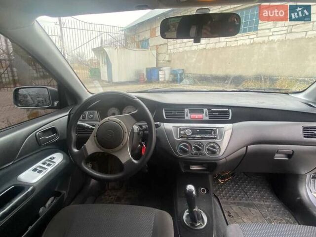 Сірий Міцубісі Lancer, об'ємом двигуна 1.58 л та пробігом 272 тис. км за 4000 $, фото 1 на Automoto.ua