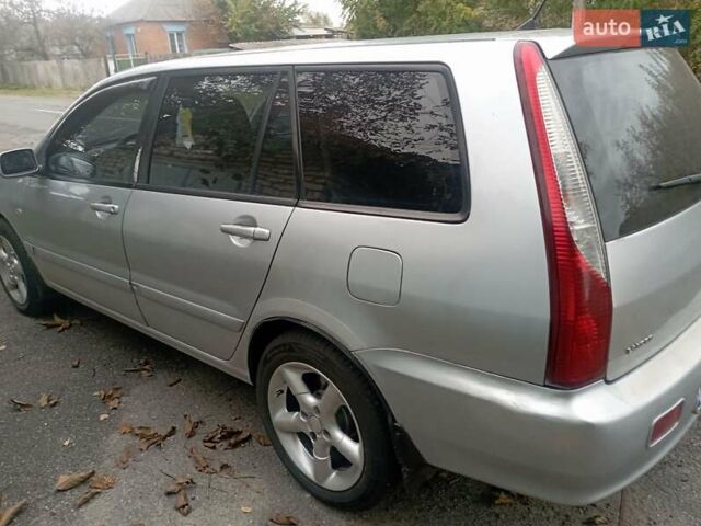 Серый Мицубиси Лансер, объемом двигателя 1.6 л и пробегом 350 тыс. км за 3000 $, фото 5 на Automoto.ua