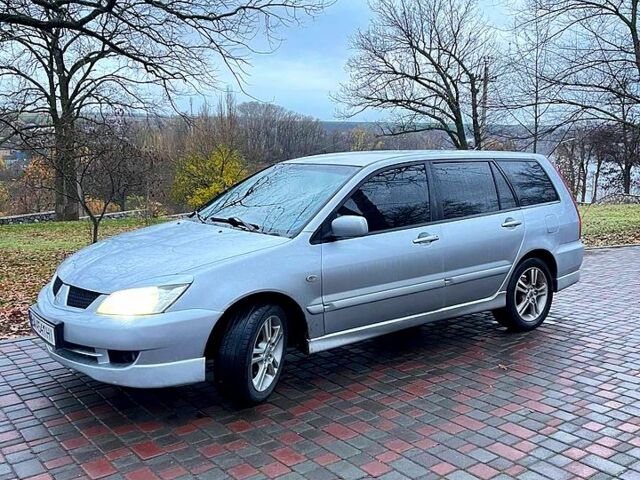 Серый Мицубиси Лансер, объемом двигателя 2 л и пробегом 346 тыс. км за 3900 $, фото 1 на Automoto.ua