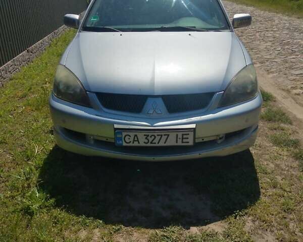 Сірий Міцубісі Lancer, об'ємом двигуна 1.58 л та пробігом 240 тис. км за 4300 $, фото 2 на Automoto.ua
