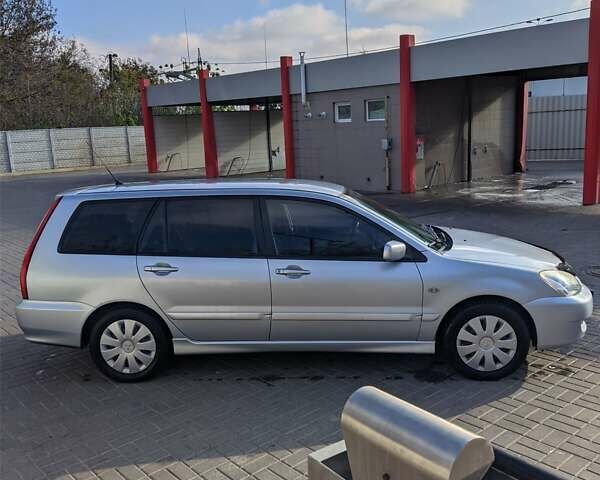 Сірий Міцубісі Lancer, об'ємом двигуна 1.58 л та пробігом 220 тис. км за 4499 $, фото 11 на Automoto.ua