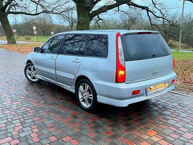 Серый Мицубиси Лансер, объемом двигателя 2 л и пробегом 346 тыс. км за 3900 $, фото 2 на Automoto.ua