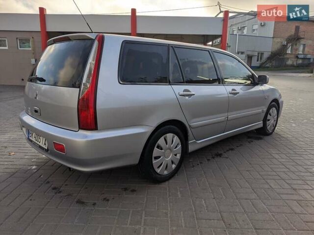 Сірий Міцубісі Lancer, об'ємом двигуна 1.58 л та пробігом 220 тис. км за 4499 $, фото 15 на Automoto.ua