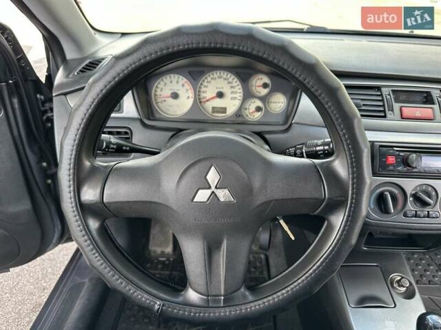 Сірий Міцубісі Lancer, об'ємом двигуна 1.59 л та пробігом 279 тис. км за 4999 $, фото 24 на Automoto.ua
