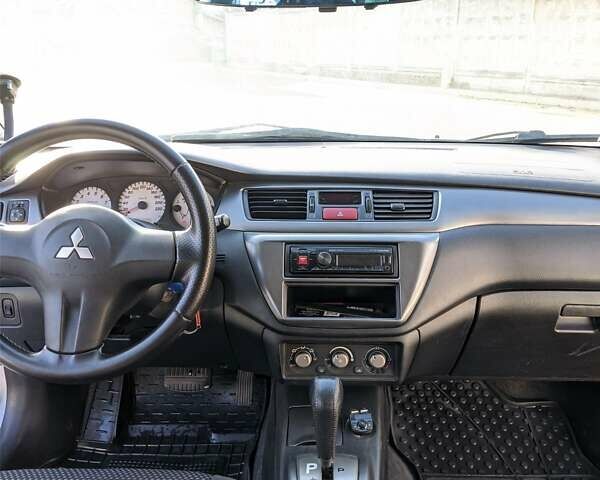Сірий Міцубісі Lancer, об'ємом двигуна 1.58 л та пробігом 220 тис. км за 4499 $, фото 27 на Automoto.ua