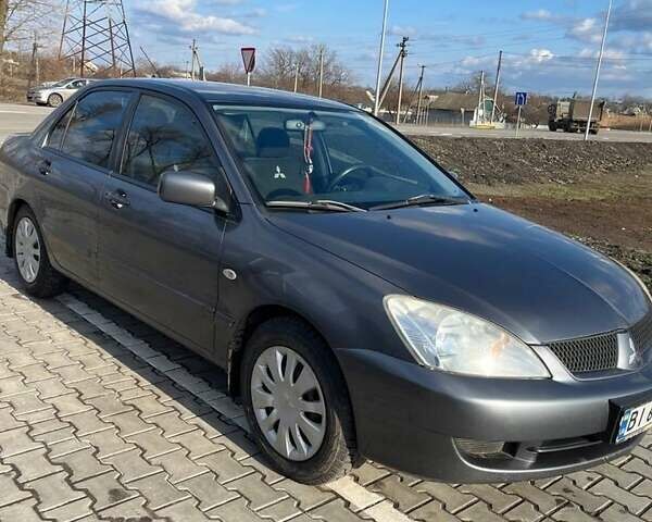Серый Мицубиси Лансер, объемом двигателя 1.6 л и пробегом 255 тыс. км за 4500 $, фото 3 на Automoto.ua