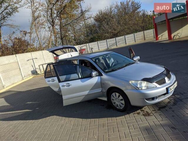 Сірий Міцубісі Lancer, об'ємом двигуна 1.58 л та пробігом 220 тис. км за 4499 $, фото 23 на Automoto.ua