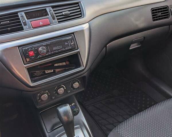 Сірий Міцубісі Lancer, об'ємом двигуна 1.58 л та пробігом 220 тис. км за 4499 $, фото 29 на Automoto.ua