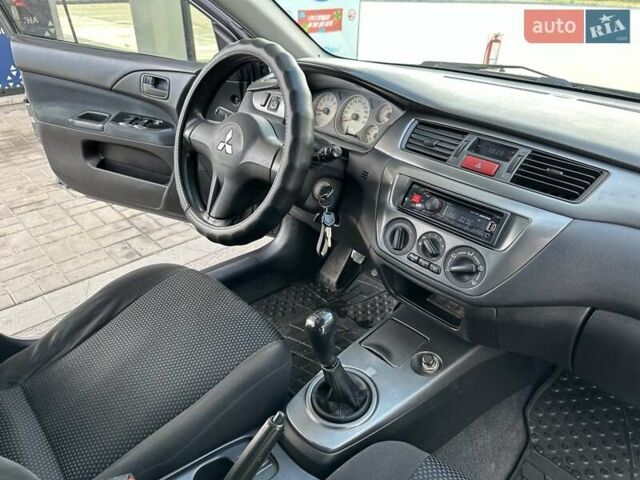 Сірий Міцубісі Lancer, об'ємом двигуна 1.59 л та пробігом 279 тис. км за 4999 $, фото 36 на Automoto.ua
