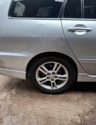 Серый Мицубиси Лансер, объемом двигателя 1.58 л и пробегом 223 тыс. км за 3200 $, фото 2 на Automoto.ua