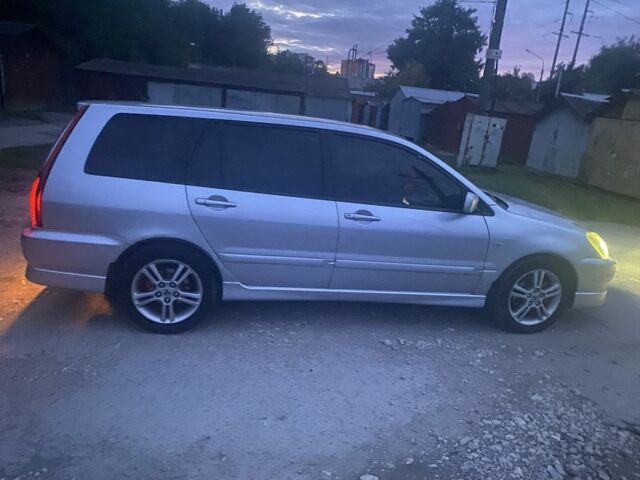 Серый Мицубиси Лансер, объемом двигателя 2 л и пробегом 250 тыс. км за 4058 $, фото 1 на Automoto.ua