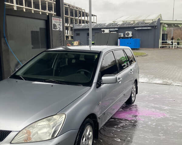 Сірий Міцубісі Lancer, об'ємом двигуна 1.58 л та пробігом 247 тис. км за 4350 $, фото 2 на Automoto.ua