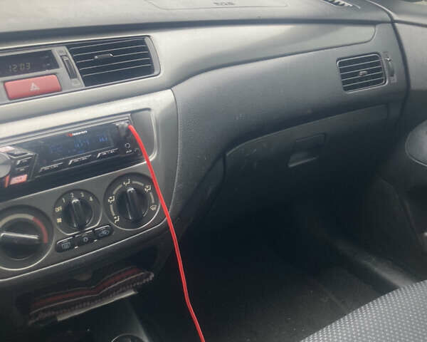 Сірий Міцубісі Lancer, об'ємом двигуна 1.58 л та пробігом 247 тис. км за 4350 $, фото 8 на Automoto.ua