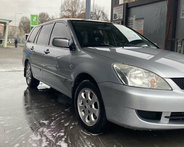 Сірий Міцубісі Lancer, об'ємом двигуна 1.58 л та пробігом 247 тис. км за 4350 $, фото 4 на Automoto.ua
