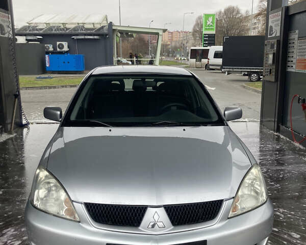 Сірий Міцубісі Lancer, об'ємом двигуна 1.58 л та пробігом 247 тис. км за 4350 $, фото 3 на Automoto.ua