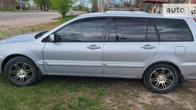 Серый Мицубиси Лансер, объемом двигателя 1.6 л и пробегом 185 тыс. км за 4700 $, фото 2 на Automoto.ua