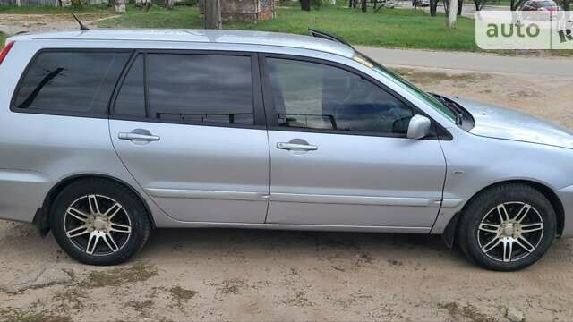 Серый Мицубиси Лансер, объемом двигателя 1.6 л и пробегом 185 тыс. км за 4700 $, фото 3 на Automoto.ua