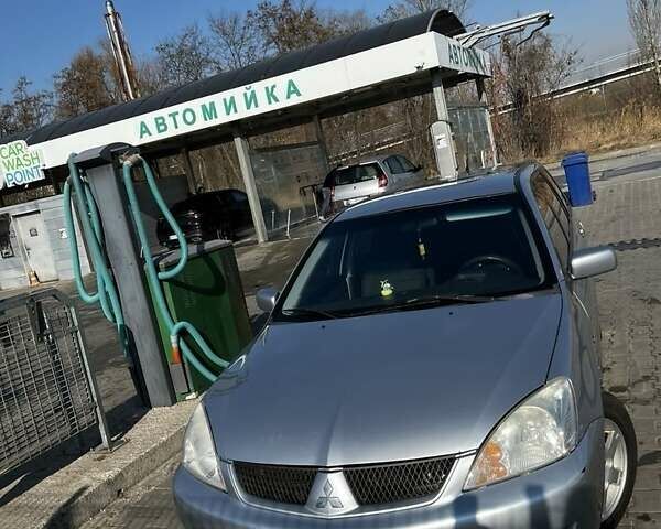 Сірий Міцубісі Lancer, об'ємом двигуна 1.6 л та пробігом 311 тис. км за 3800 $, фото 9 на Automoto.ua