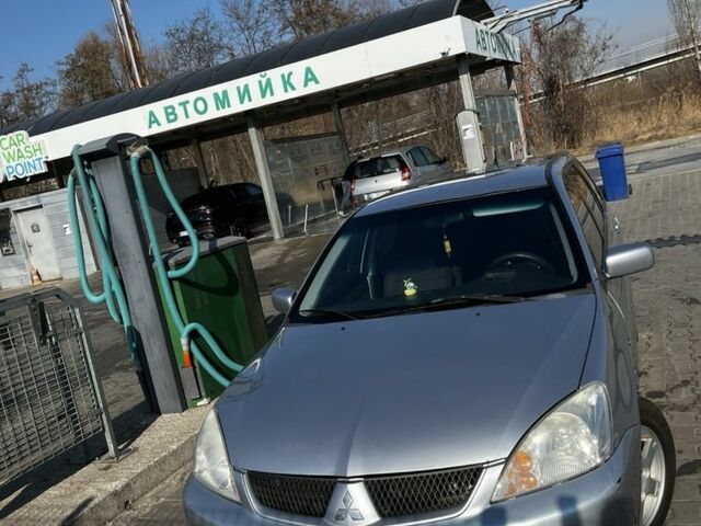 Сірий Міцубісі Lancer, об'ємом двигуна 1.6 л та пробігом 311 тис. км за 3800 $, фото 10 на Automoto.ua