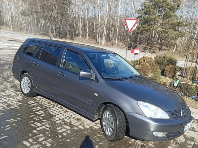 Сірий Міцубісі Lancer, об'ємом двигуна 1.58 л та пробігом 246 тис. км за 4100 $, фото 4 на Automoto.ua