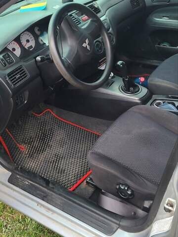 Серый Мицубиси Лансер, объемом двигателя 1.6 л и пробегом 185 тыс. км за 4700 $, фото 6 на Automoto.ua