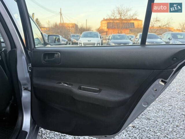 Серый Мицубиси Лансер, объемом двигателя 1.6 л и пробегом 278 тыс. км за 3900 $, фото 12 на Automoto.ua