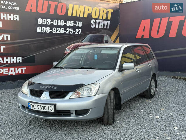 Серый Мицубиси Лансер, объемом двигателя 1.6 л и пробегом 278 тыс. км за 3900 $, фото 1 на Automoto.ua