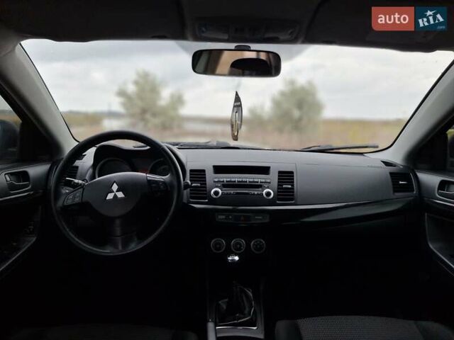 Мицубиси Лансер 2008 в Новомосковске на Automoto.ua Синий Мицубиси Лансер, объемом двигателя 1.8 л и пробегом 223 тыс. км за 4950 $, фото 9 на Automoto.ua