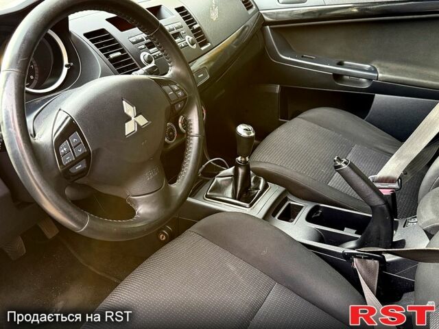 Синій Міцубісі Lancer, об'ємом двигуна 1.8 л та пробігом 222 тис. км за 4750 $, фото 4 на Automoto.ua