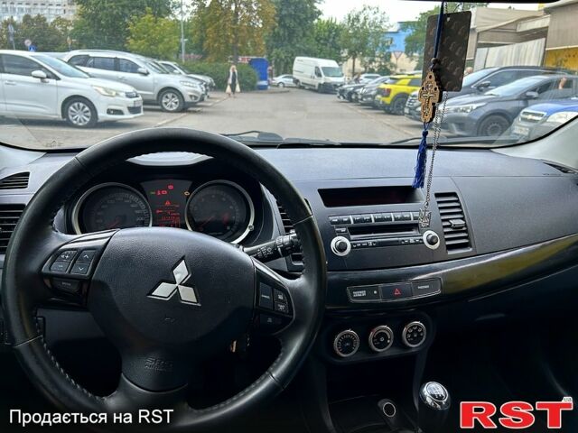 Синій Міцубісі Lancer, об'ємом двигуна 1.8 л та пробігом 221 тис. км за 6900 $, фото 4 на Automoto.ua